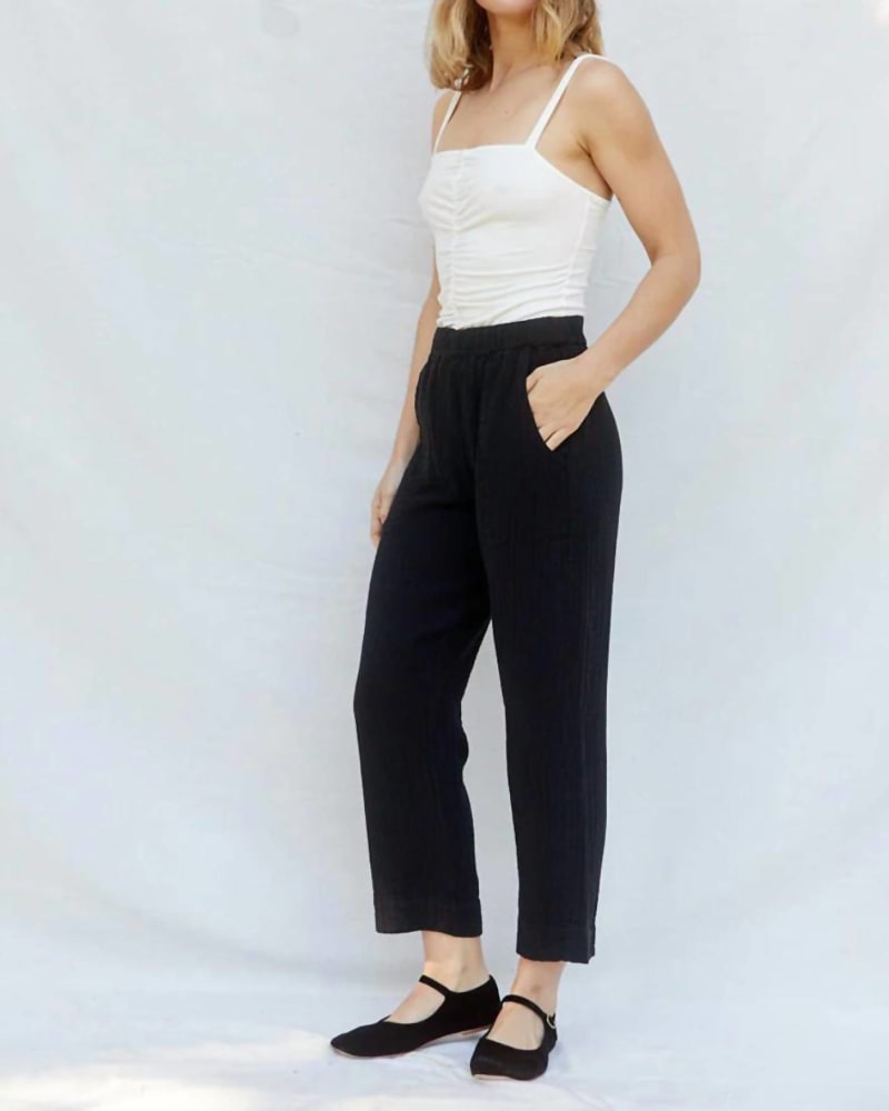 Front of a model wearing a size L Cara Pants in Black in Black by SUGAR CANDY MOUNTAIN. | dia_product_style_image_id:332180